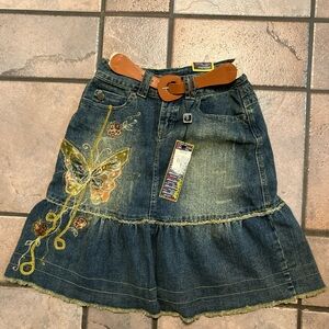 Y2K Joujou embroidered butterfly denim skirt with a ruffle hem and brown belt.